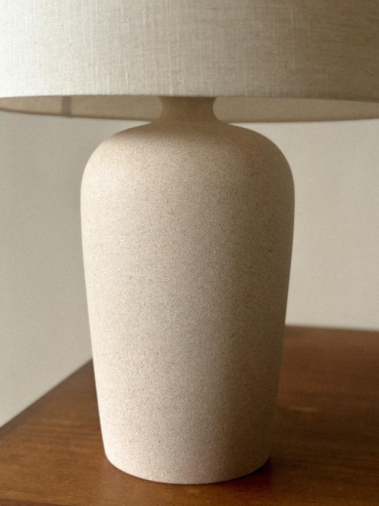 Side view of vintage French lamp with sculpted ceramic base