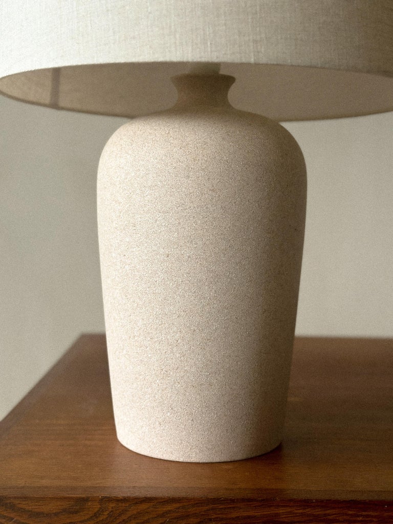 Vintage French ceramic lamp on wooden table