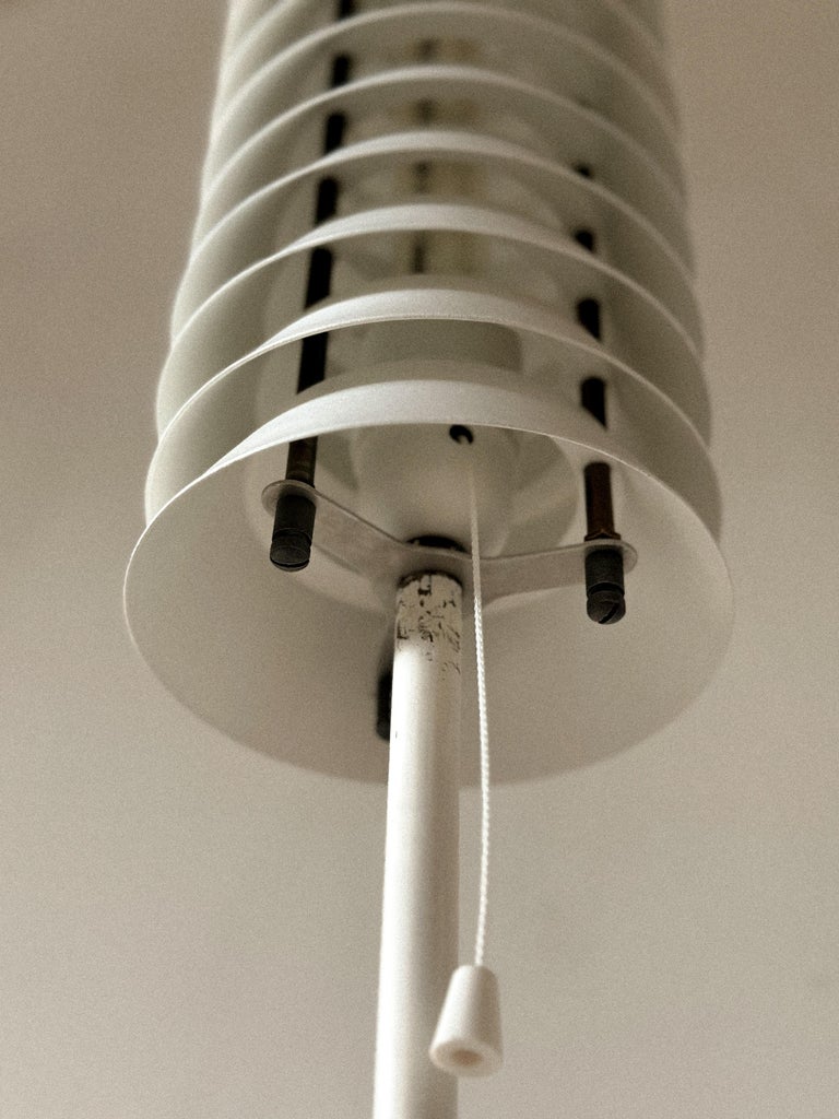 1950s Scandinavian lamp casting soft ambient glow