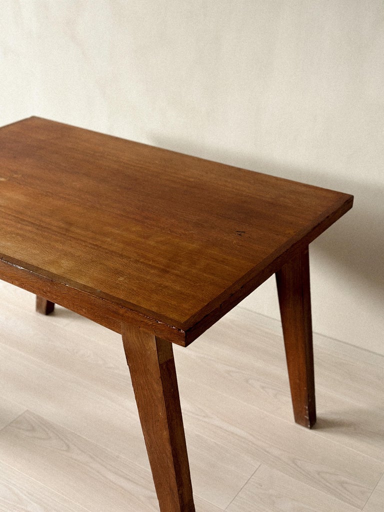 French oak dining table with wide plank top and V-shaped legs