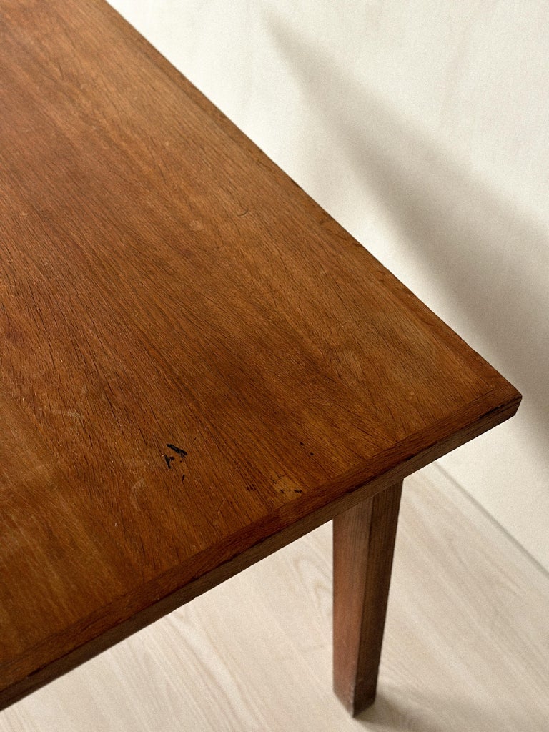 Vintage oak table in Jeanneret style against neutral background