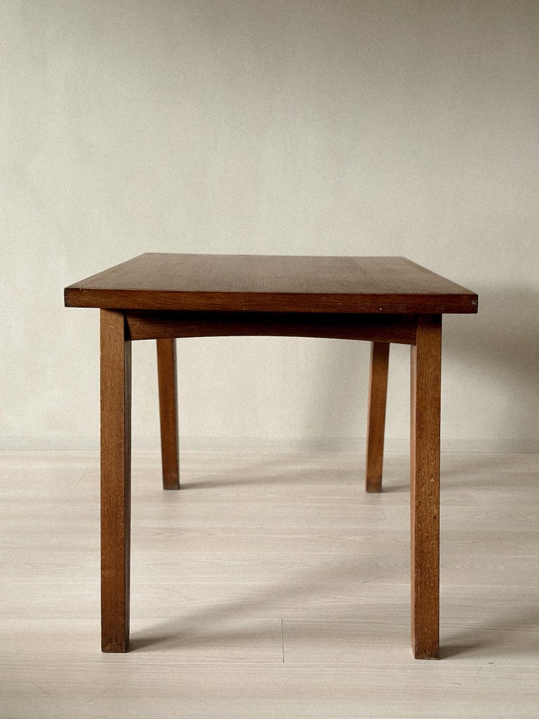 Angular leg design of vintage French oak table