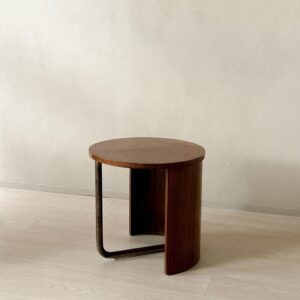 Vintage French table with round top and sculptural side profile
