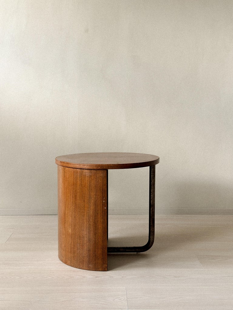 Sculptural French side table with rounded oak body and iron support