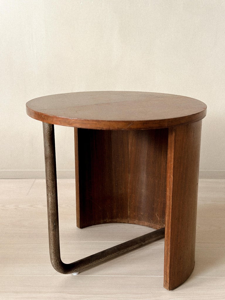 Organic-shaped oak side table with exposed industrial foot
