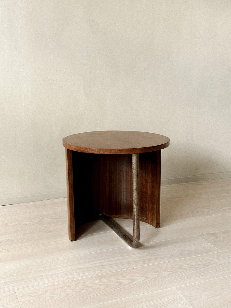 Curved wood and metal leg detail on French modern side table