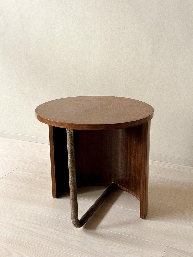 Mid-century oak side table with curved wood panel and metal foot