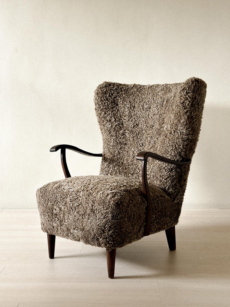 Front view of organic Danish chair with winged back