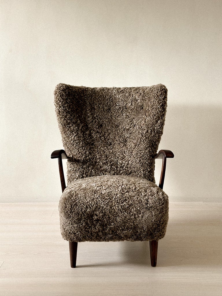 1940s Danish cabinetmaker lounge chair in dark brown sheepskin