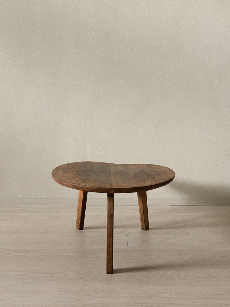 French modernist table with irregular wooden top and angled legs