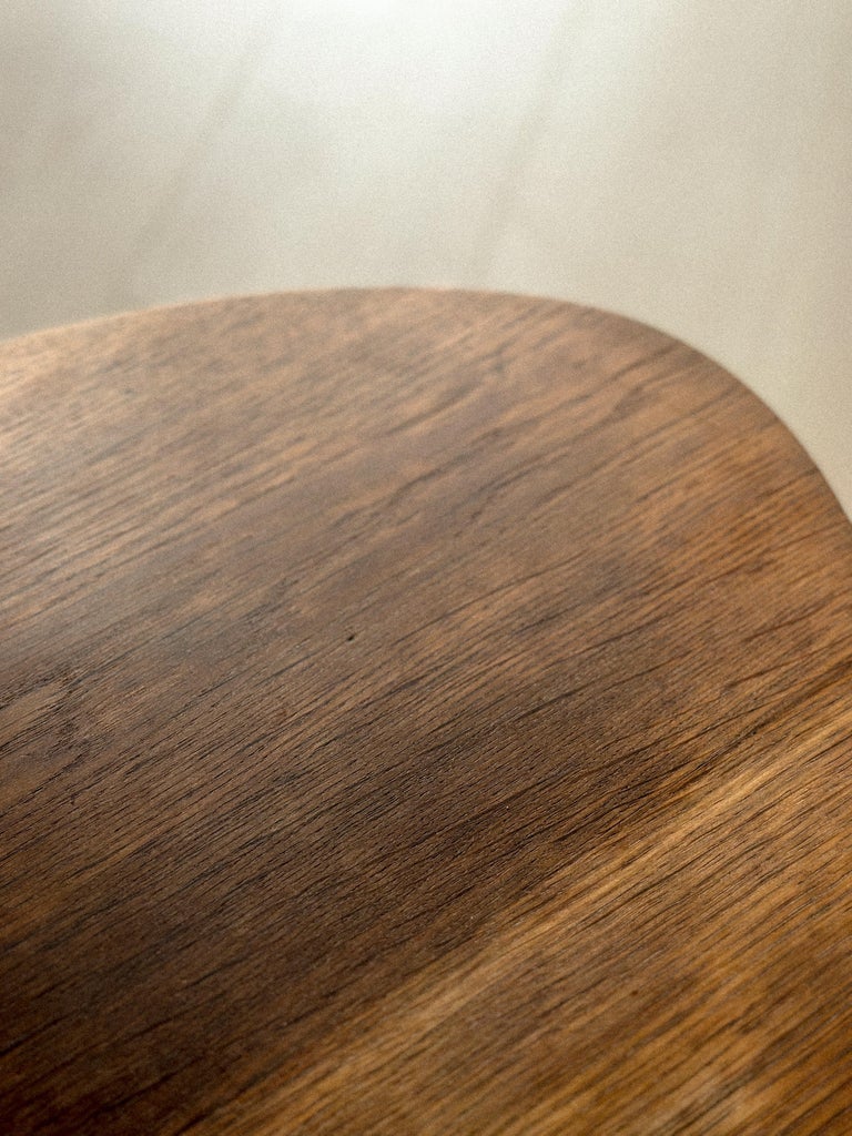 Wooden Guariche table with biomorphic shape and three-legged base