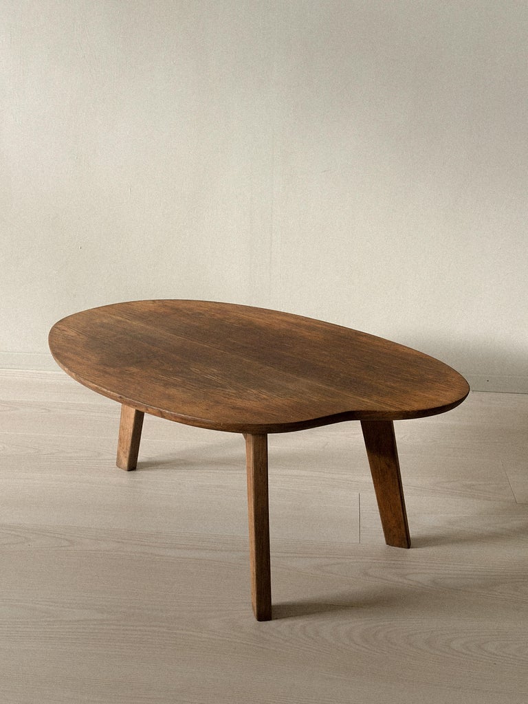 Mid-century side table by Pierre Guariche with sculpted wood form