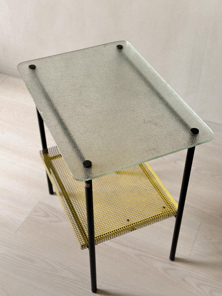 1950s table by Paul Grivois featuring black metal frame and colored industrial materials