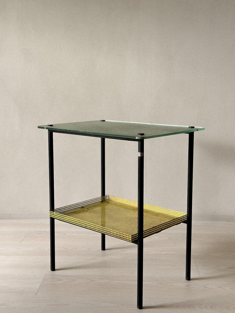 Industrial design table with green textured glass and steel tubing