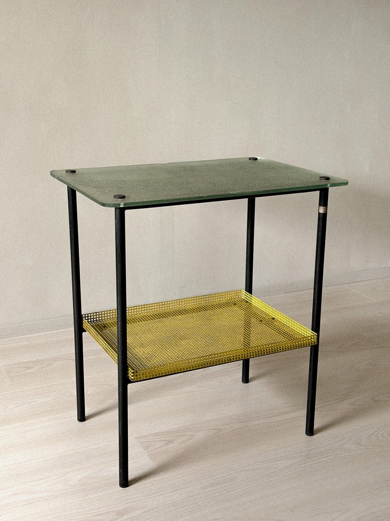 Rare side table by Paul Grivois with green St-Gobain glass top and yellow mesh shelf