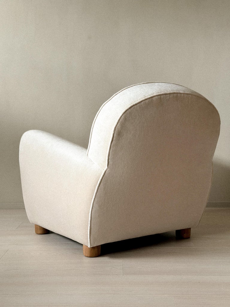 Modern club-style chair with deep seat and soft edges