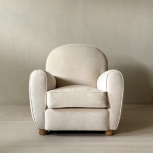 The Valette Chair with soft curved silhouette and oak legs