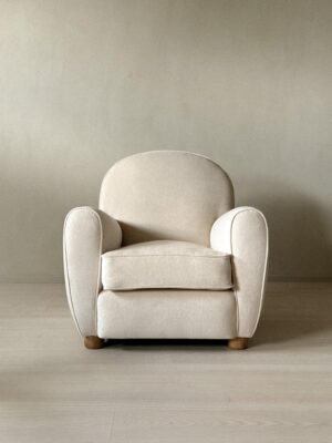 The Valette Chair with soft curved silhouette and oak legs