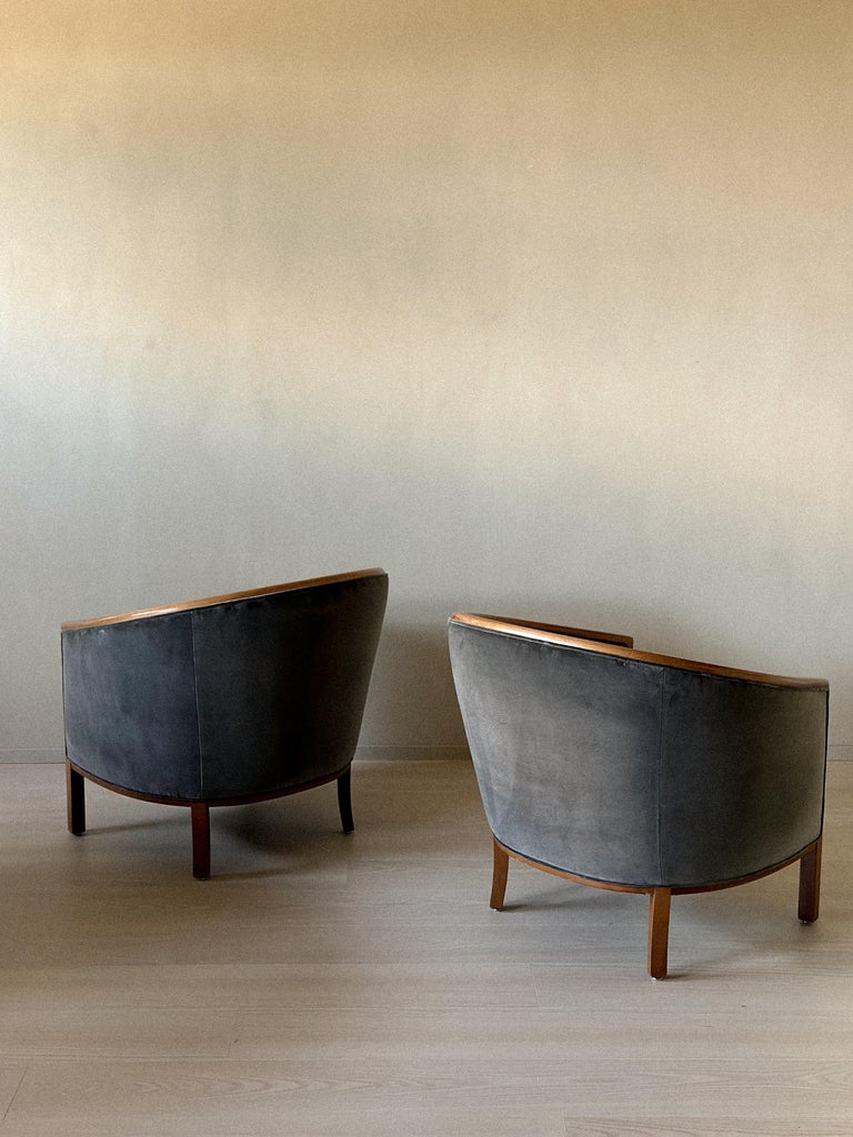 Side view of curved-back egg chairs in shimmering grey fabric