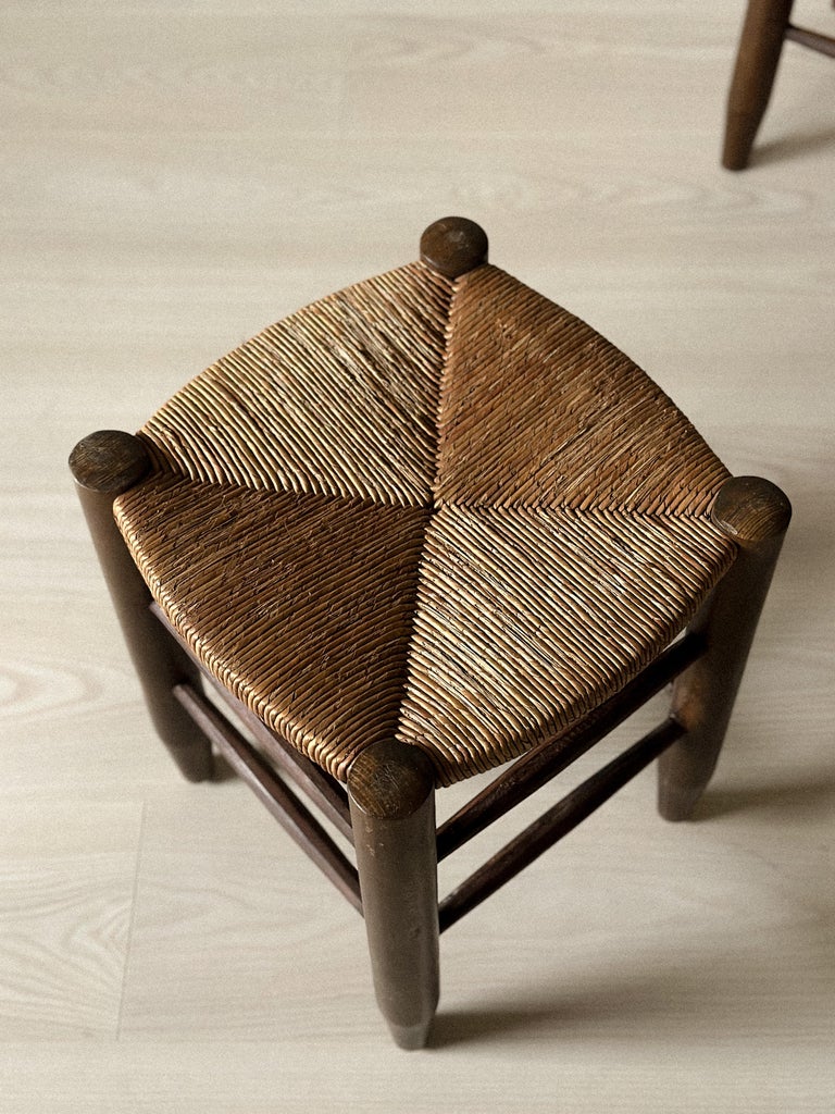 Close-up of rattan seat on Charlotte Perriand Bauche stool