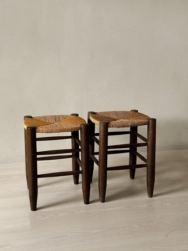 Pair of mid-century stools by Charlotte Perriand in natural materials
