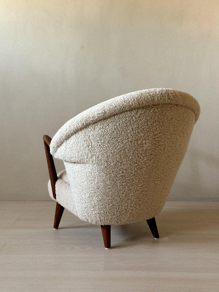 Sheepskin and wood lounge chair with Scandinavian lines