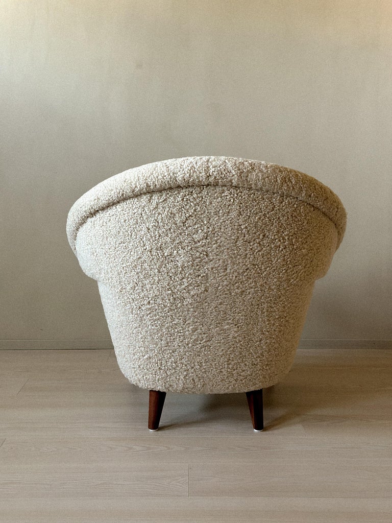 Back view of model 2222 armchair showing tapered legs