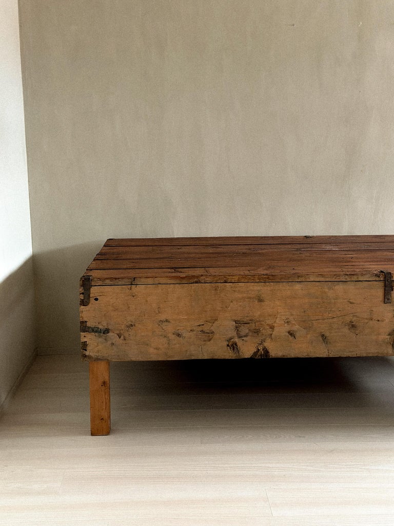 Console with aged surface and primitive joinery