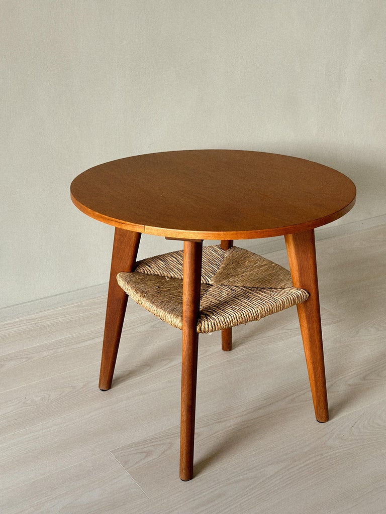 Three-quarter angle of vintage Danish table with rush detail