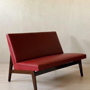 Side view of Pierre Jeanneret–style red skai bench