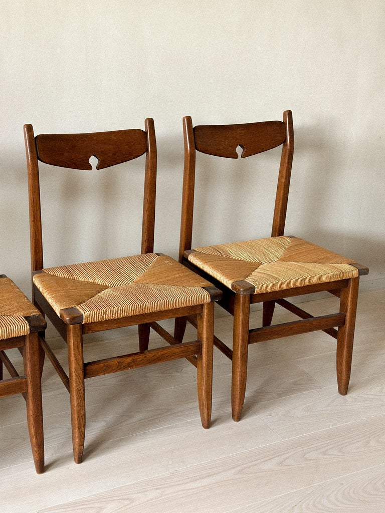 Group of French oak chairs with consistent rustic tone