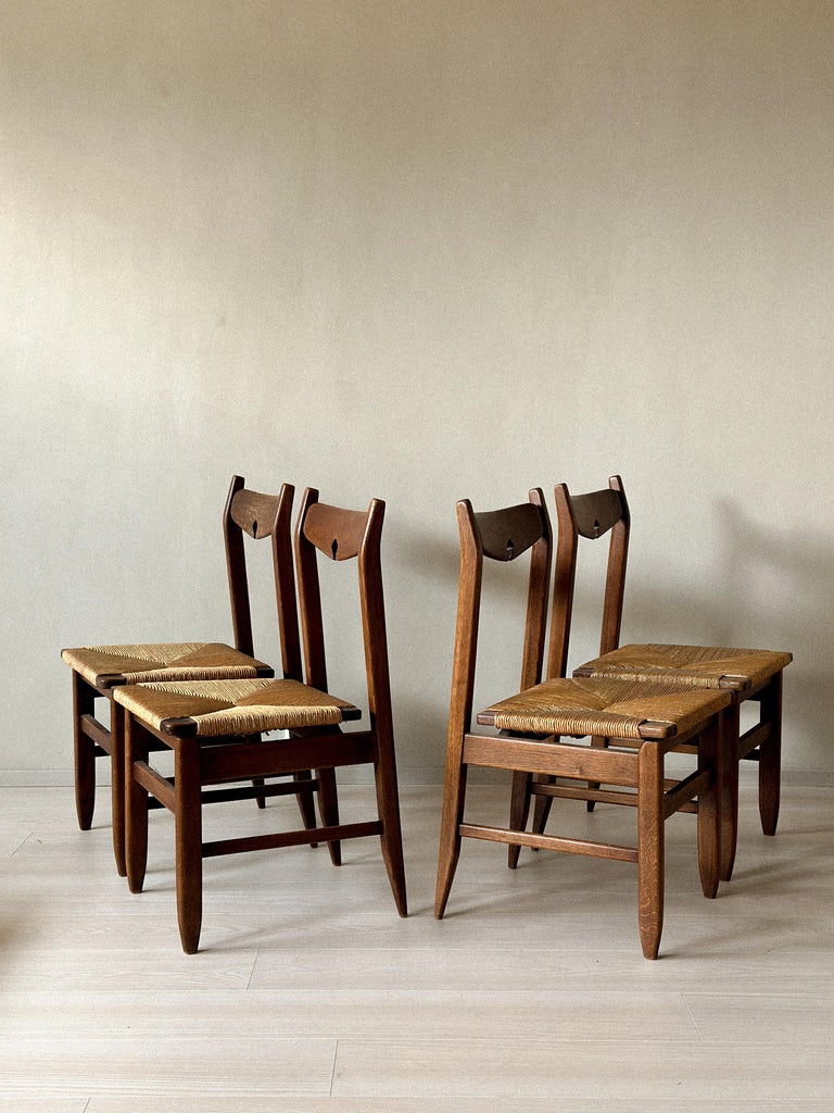 Set of four vintage French chairs in oak and rush