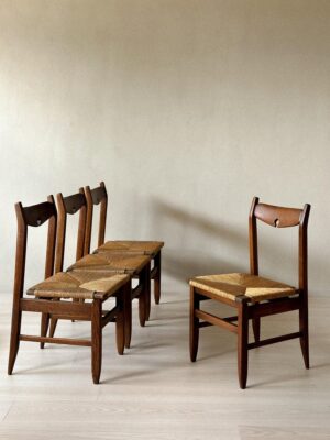 Set of four oak dining chairs with rush seats by Guillerme et Chambron