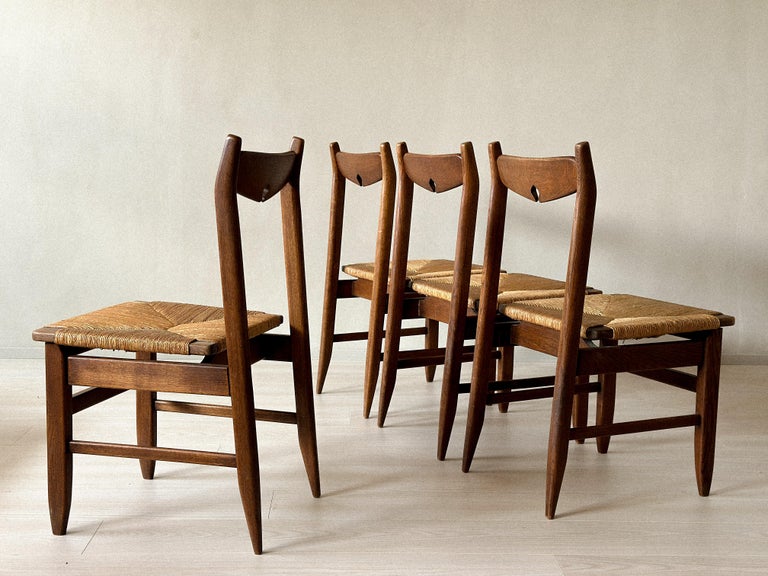 Vintage French chairs with worn rush and patinated oak