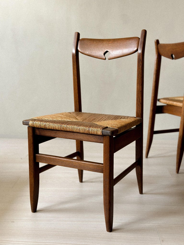 Detail of joinery and wood grain on Guillerme et Chambron chairs