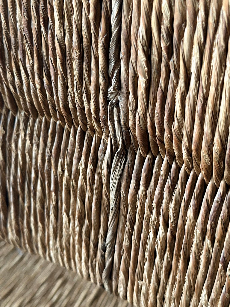 Close-up of rush seat weaving on dining chair