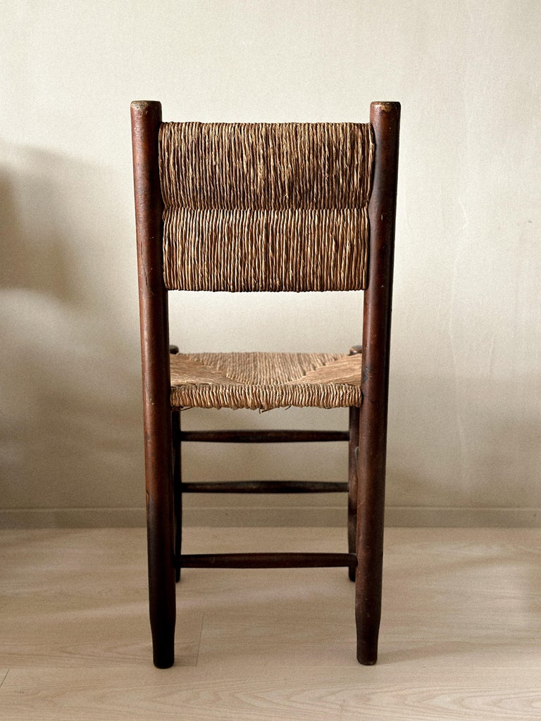 Back view of Charlotte Perriand-style dining chairs