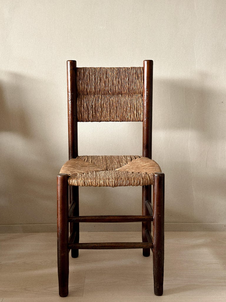 Set of twelve French rush dining chairs, front view