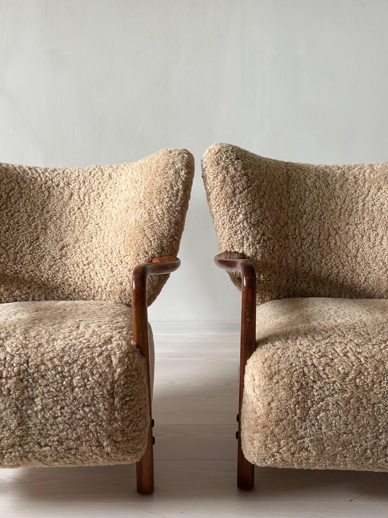 Viggo Boesen chairs facing each other with low profile