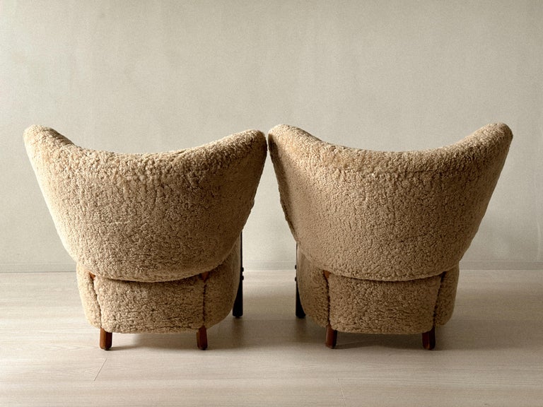 Pair of Danish shearling chairs by Boesen, viewed from behind