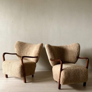 Pair of Viggo Boesen shearling armchairs with curved form
