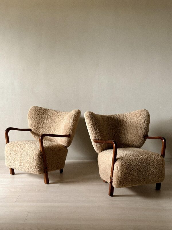 Pair of Viggo Boesen shearling armchairs with curved form