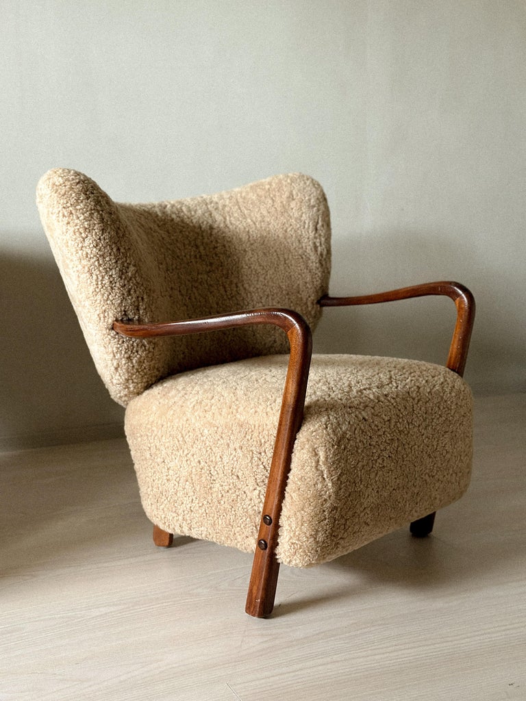 Front view of Danish modern shearling armchairs by Viggo Boesen