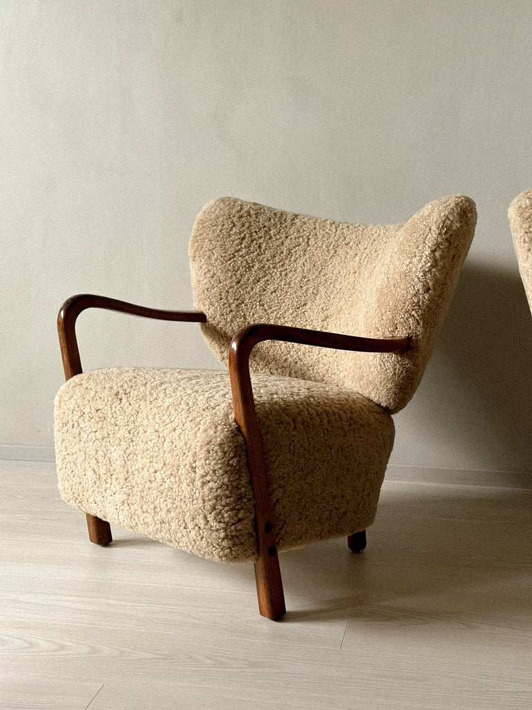Three-quarter view of Viggo Boesen chairs with round, organic shape