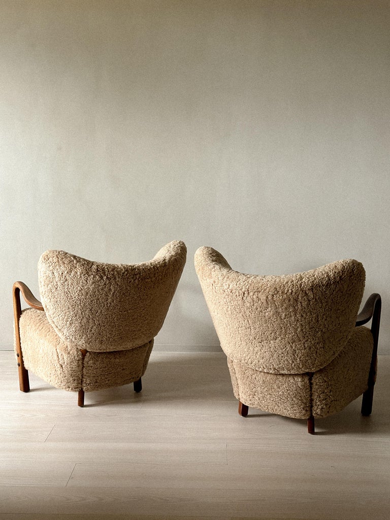 Pair of vintage shearling chairs in daylight interior