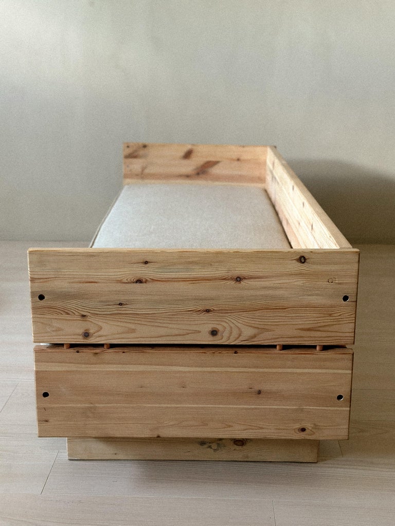 Side view of pine daybed with sharp minimalist lines