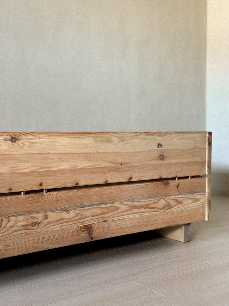 Minimalist wooden daybed with functional form