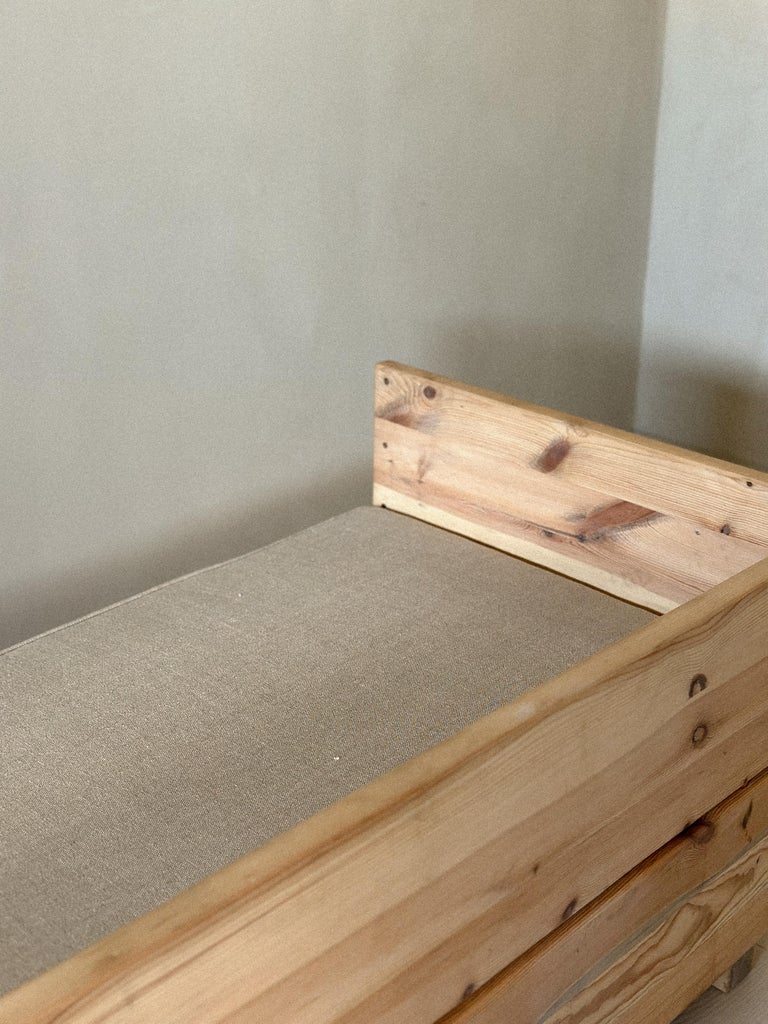 Overhead view of daybed with rectangular form and linen top