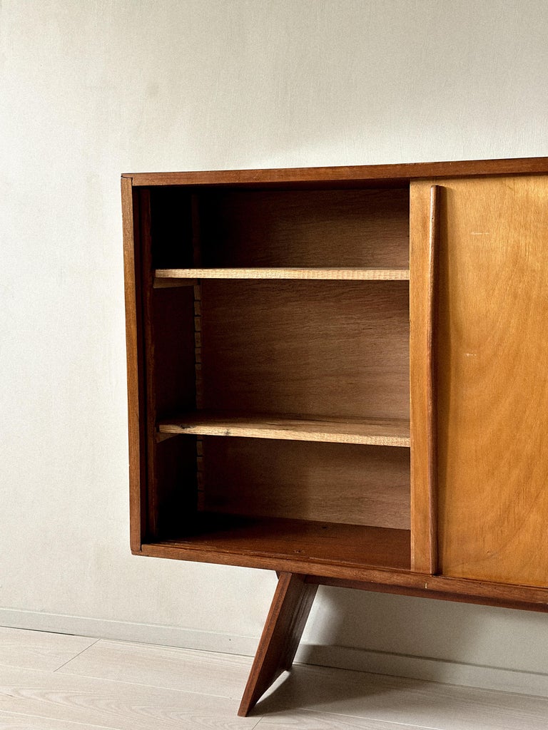 Sliding door detail on vintage Perriand-style cabinet