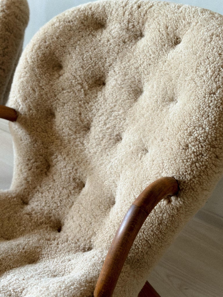 Three-quarter angle of Clam Chairs in white shearling